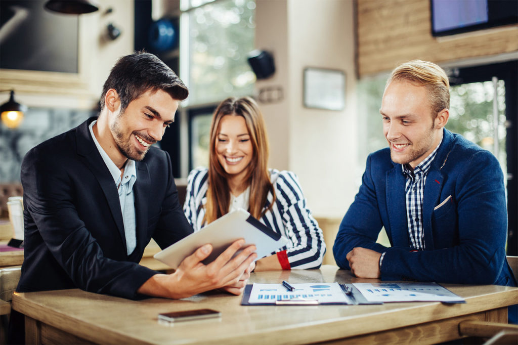 Professionals discussing about investing
